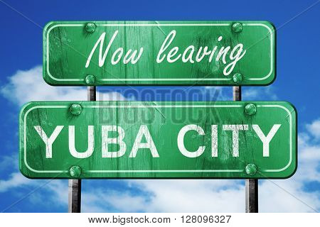 Leaving yuba city, green vintage road sign with rough lettering