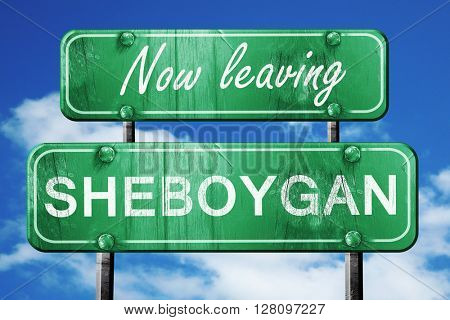 Leaving sheboygan, green vintage road sign with rough lettering