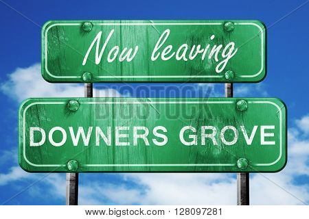 Leaving downers grove, green vintage road sign with rough letter
