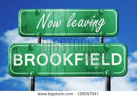 Leaving brookfield, green vintage road sign with rough lettering