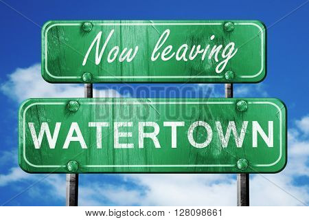 Leaving watertown, green vintage road sign with rough lettering