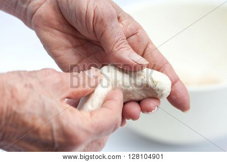 Cassava bread preparation : shaping colombian cassava bread (Pandeyuca)