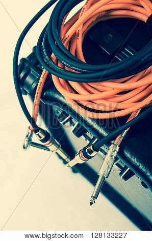 Close-up of guitar amplifier with jack cable.