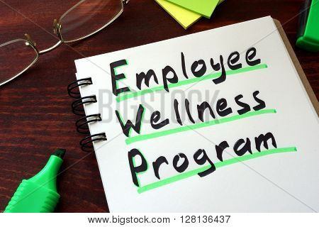 Employee Wellness program written on a notepad with marker.