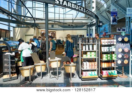 CHICAGO, IL - CIRCA APRIL, 2016: Starbucks Cafe at O'Hare Airport. Starbucks Corporation is an American global coffee company and coffeehouse chain based in Seattle, Washington