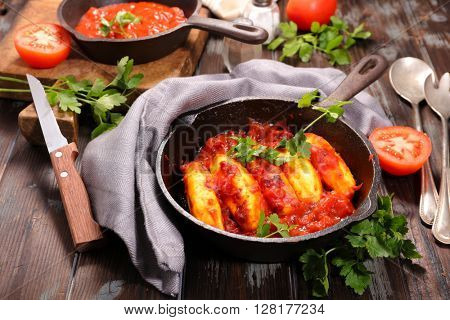 quenelle with tomato sauce