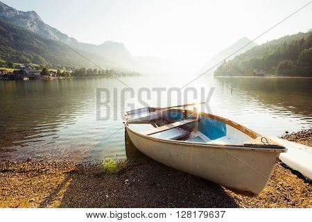 Fantastic views of the morning lake glowing by sunlight. Dramatic and picturesque scene. Location: resort Grundlsee, Liezen District of Styria, Austria, Alps. Europe. Beauty world. Instagram effect.