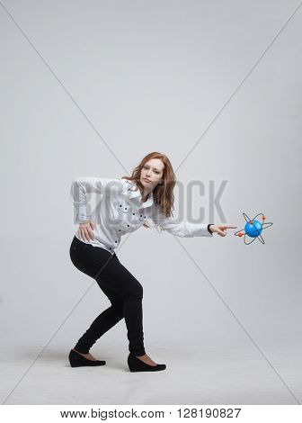 Woman scientist with atom model, research concept