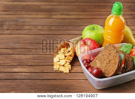 Kid school lunch on wooden background