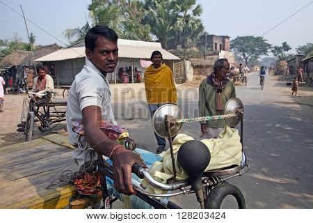 BARUIPUR, INDIA - JANUARY 14: Rickshaw driver waits for the next customer on January 14, 2009 in Baruipur, West Bengal, India. 