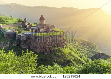 Ancient monastery in setting sun. Tatev. Armenia