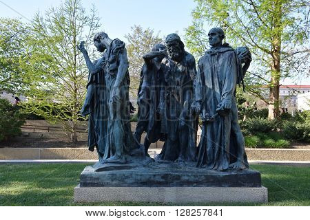 WASHINGTON, DC - APR 16: Les Bourgeois de Calais sculpture by Auguste Rodin at the Hirshhorn Sculpture Garden in Washington, DC, on April 16, 2016. In 2013, the Sculpture Garden drew 645,000 visitors.