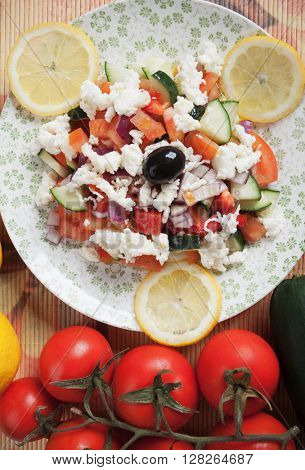 Shopska salad with white cheese, tomato, cucumber, pepper, onion and olives