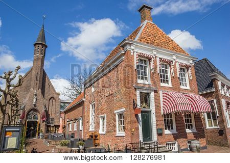 APPINGEDAM, NETHERLANDS - APRIL 16, 2016: Old house and church in the center of Appingedam, Netherlands
