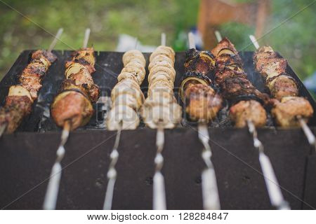 fried meat and mushrooms fried on the grill