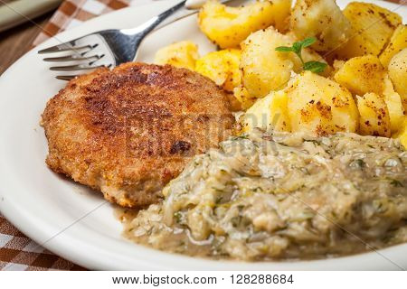 Delicious Meal Of Minced Meat Cutlet, Potatoes And Fried Cabbage.