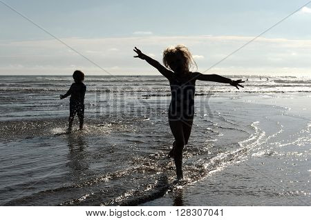 Children playing on a Cornish beach during summer