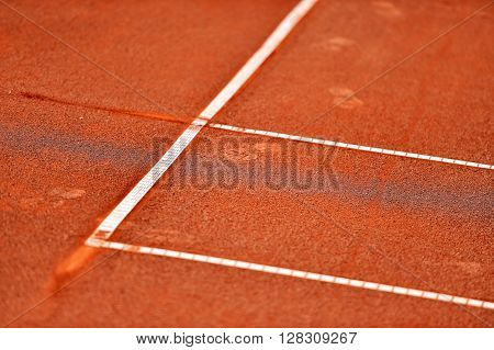 Detail with a baseline footprint on a tennis clay court