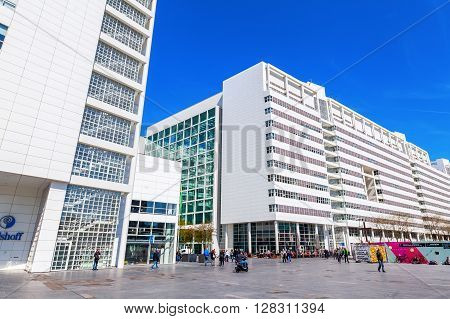 The Hague Netherlands - April 21 2016: New City Hall of The Hague with unidentified people. It was designed in 1986 by American architect Richard Meier and completed in 1995