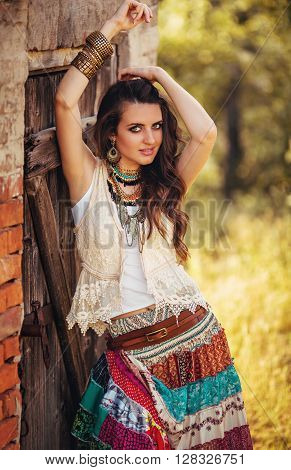 Beautiful young girl in clothes in the style boho