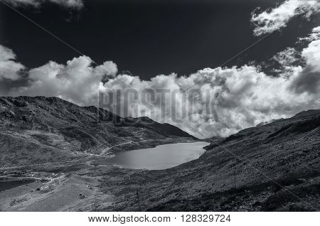Elephant Lake named due to it's shape as a lying elephant remote high altitude lake at kupup Valley Sikkim. Himalayan mountain range Sikkim India - black and white image