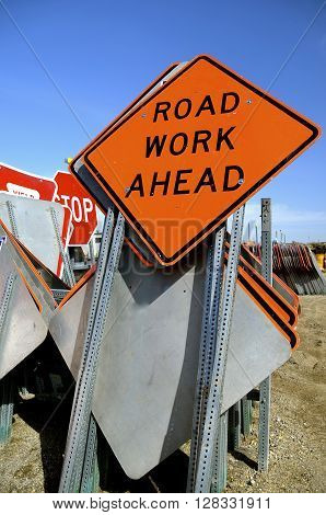 Traffic signs in storage "Road Work Ahead" for construction sites