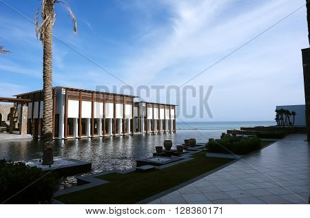 HERAKLION, CRETE, GREECE - MAY 13, 2014: The big blue swimming-pool with columns in luxury class hotel Grecotel Amirandes, May 13, 2014, Greece.