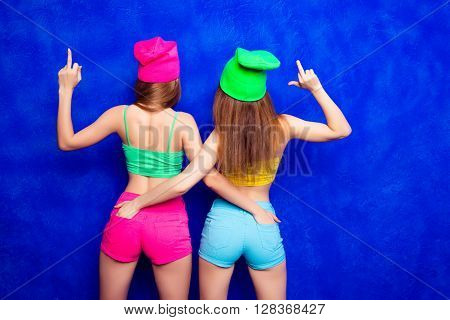 Back View Of Trendy Women Showing Midle Finger