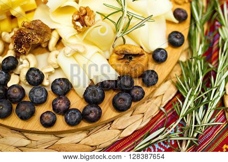 Still life photo with Georgian cheese apple grape fig