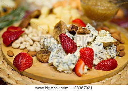 Still life photo with Georgian cheese strawberry grape etc
