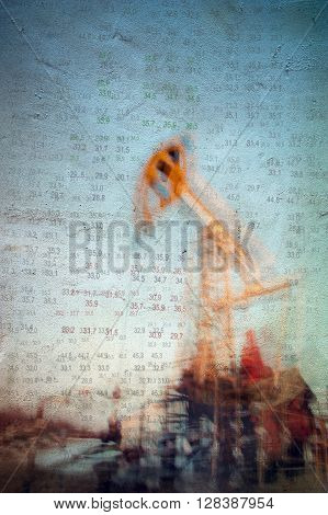 Work of oil pump jack on a oil field and finance analytics background. Textured concrete grunge blurred motion. Numbers figures. Concept oil and gas crisis.
