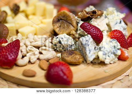 Still life photo with Georgian cheese fig grape almonds