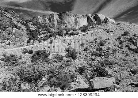 In Oman  The Old Mountain Gorge And Canyon The Deep Cloudy  Sky