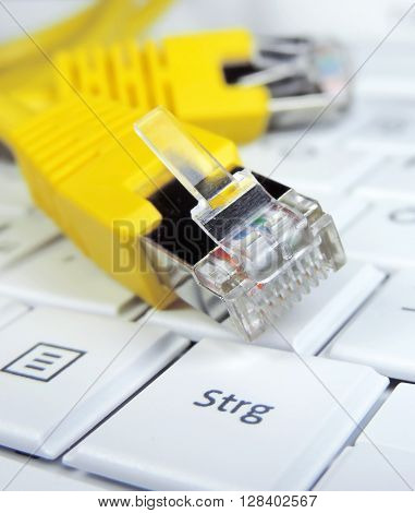 High speed internet connection. Computer cable on a computer keypad.