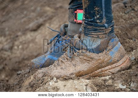 Mud race runners,muddy running shoes,,after a run in the mud.