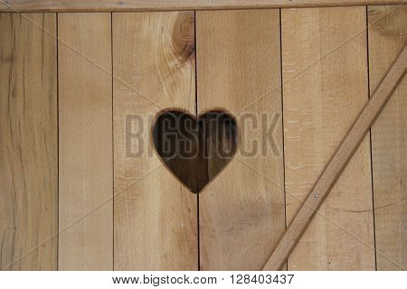 pictureof a heart shape on a wooden palte