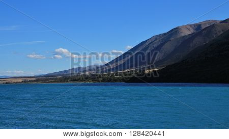 Mountain range and turquoise water of Lake Ohau. Landscaoe in New Zealand.