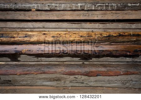 Wooden beams. Perspective composition with long beams. Exterior scene with building material. Roof building wooden components. Carpentery beam.