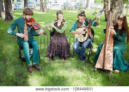 MOSCOW, RUSSIA - MAY 30, 2015: Musical Band Polca an Ri plays music outdoor in forest on summer day.
