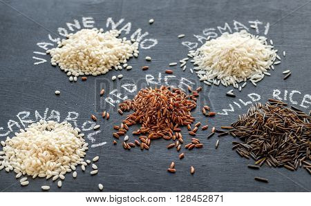 Different Kinds Of Rice On The Dark Background