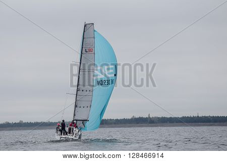 KYIV, UKRAINE - APRIL 26, 2016: Traning on the new model of yacht OceanTECH L30 on the Kyiv water reservoir or Kyiv SEA with Rodion Luka, L30 idea author, Silver Olympic medalist.