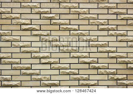 a wall of a wild yellow decorative stone