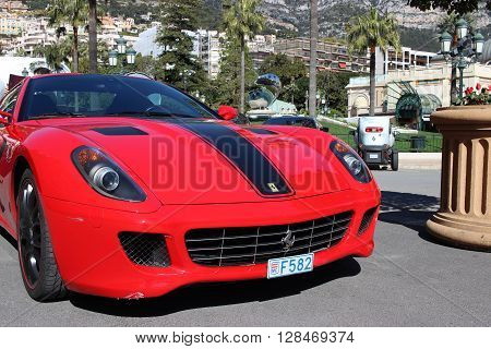 Monte-Carlo Monaco - March 9 2016: Red Ferrari 430 Scuderia Parked in Front of the Monte-Carlo Casino in Monaco