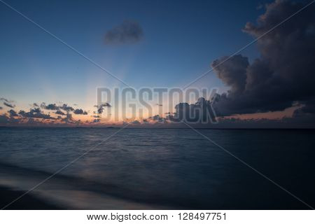 Sunset on the beach with beautiful cloudy sky