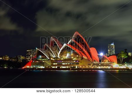 Long exposure of SYDNEY AUSTRALIA - August, 8, 2016: View of Sydney Opera House and with red light celebrate chainese new year in Sydney Australia Over 10 millions tourists visit Sydney every year