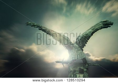 Turul bird with a sword with apocalyptic sky in the Royal Castle, Budapest, Hungary