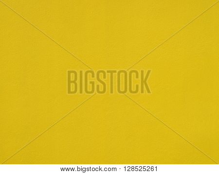 Closeup on yellow cement background. Abstract gold background yellow color vintage grunge background texture gold yellow cement layout design for warm colorful background.