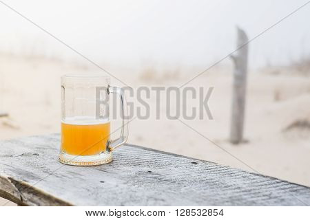 Mug With Wheat Beer On The Bench