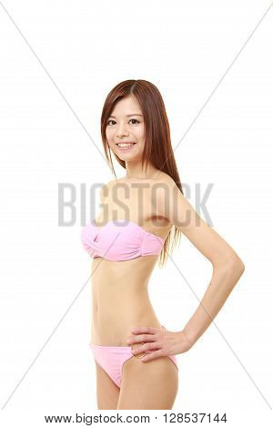 portrait of young Japanese woman in a pink bikini