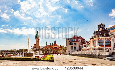 SOPOT, POLAND - MAY 03, 2016: People relaxing on square near famous pier in Sopot. Sopot is a famous tourist resort located in Poland.